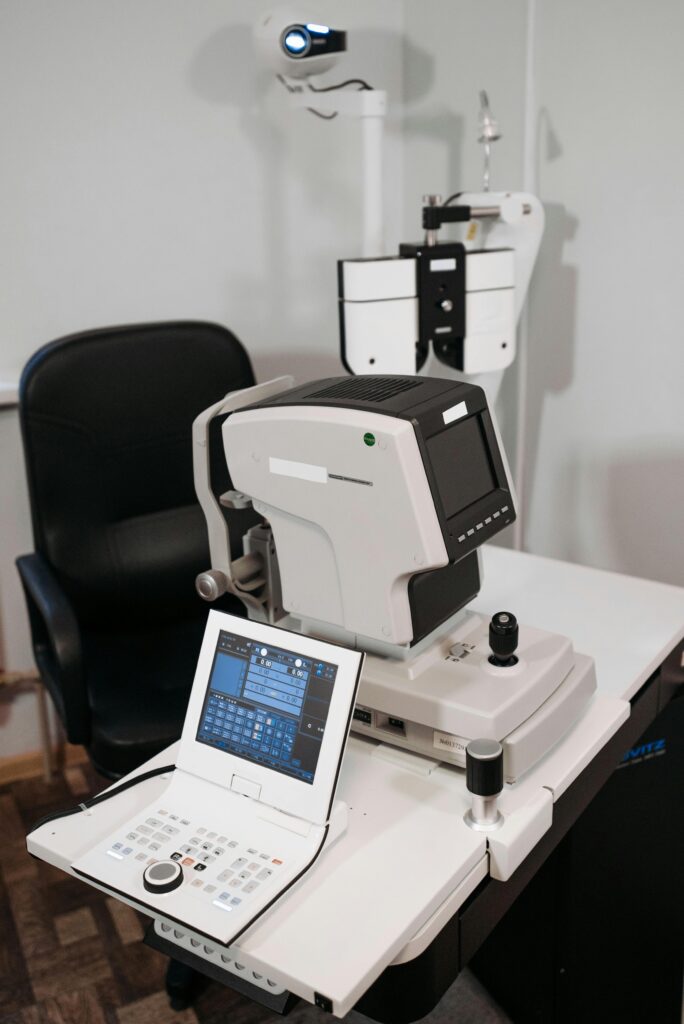 Advanced ophthalmology equipment setup in a modern optometrist office.